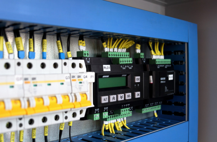 Wired control panel with circuit breakers and a compact PLC